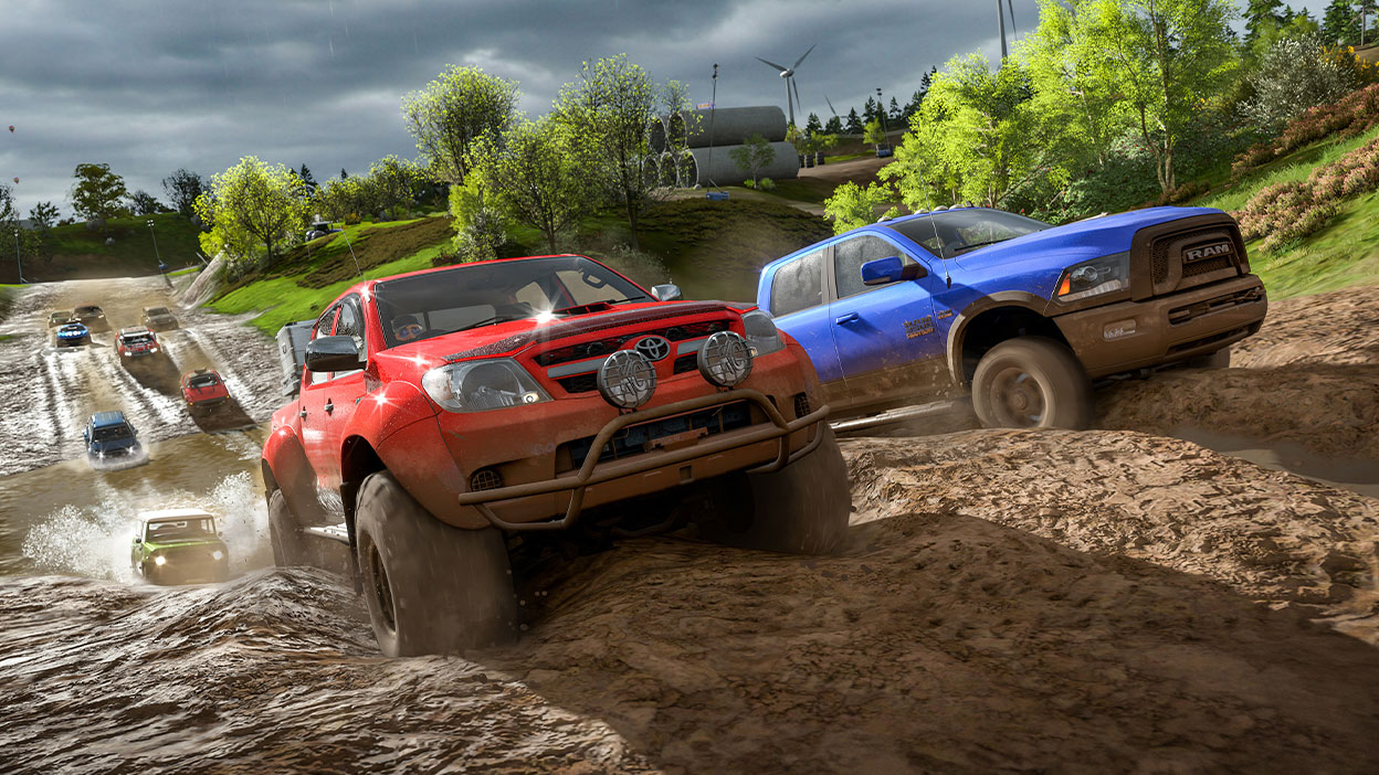 Пикап Toyota и Dodge Ram соревнуются друг с другом на грунтовой сельской дороге